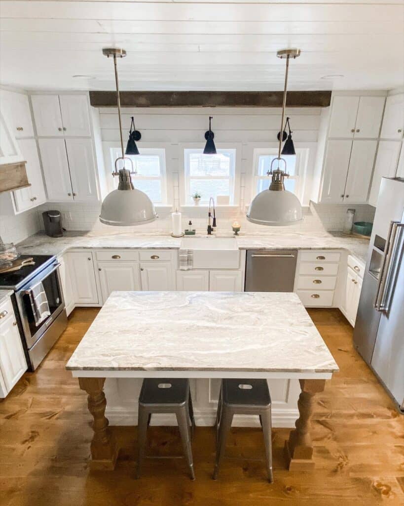 Grey Lamps Over U Shaped Kitchen Island With Seating