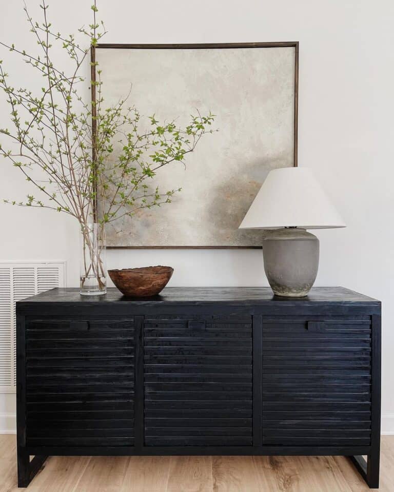 Grey Picture Over Black Sideboard