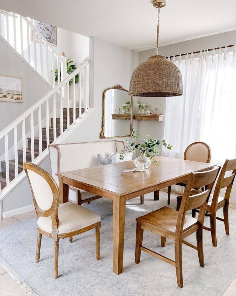 Hanging Rattan Lamp Over Wooden Dining Room Table