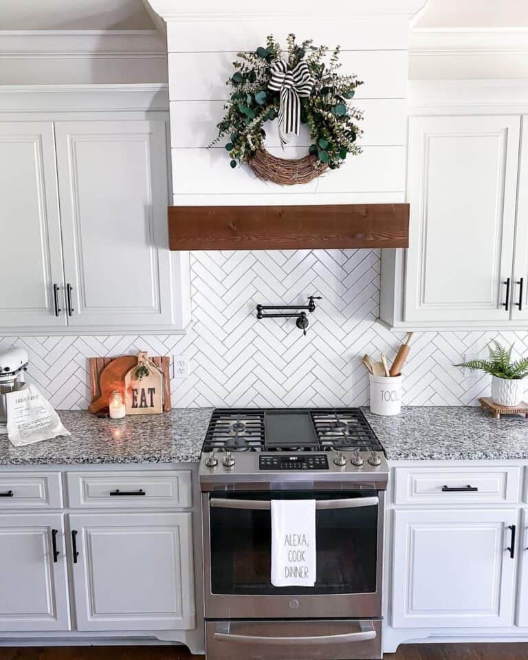 Herringbone Backsplash with Granite Countertops of Black and White