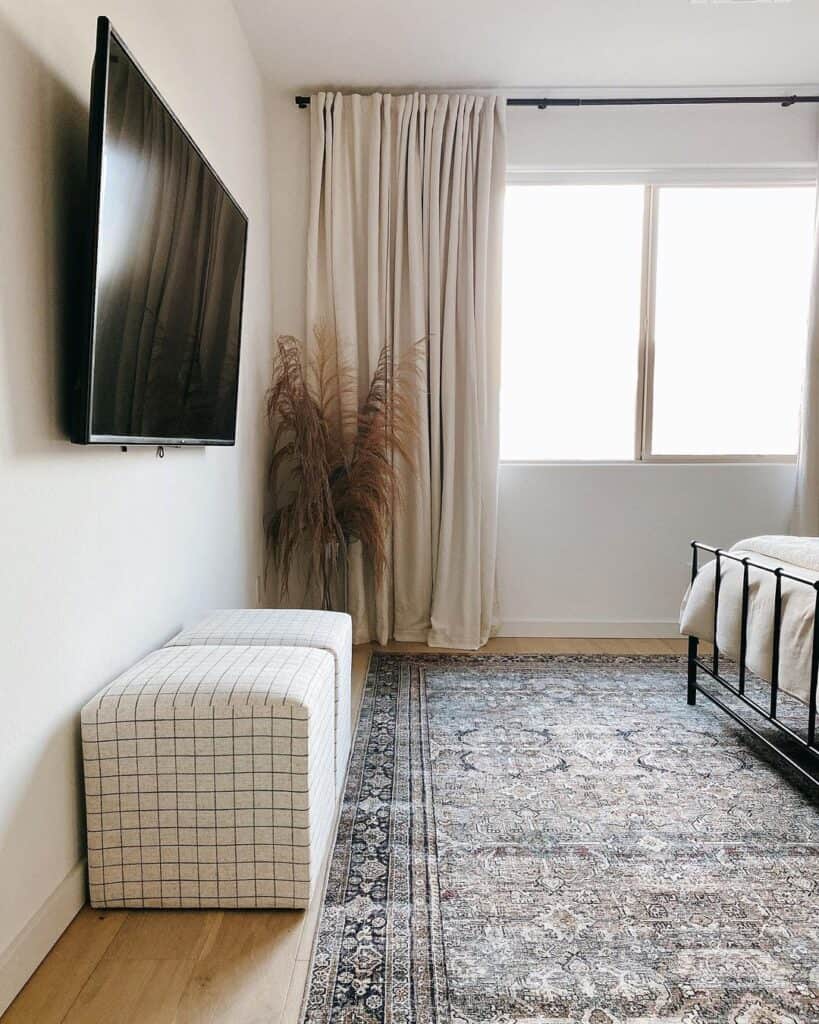 Ivory Duvet with Matching Drapes and Patterned Cubed Ottoman