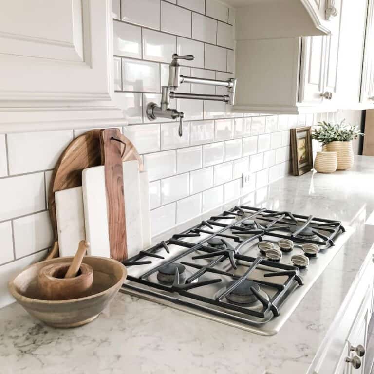 Kitchen Featuring Subway Tile with Granite Countertops of Pearl White