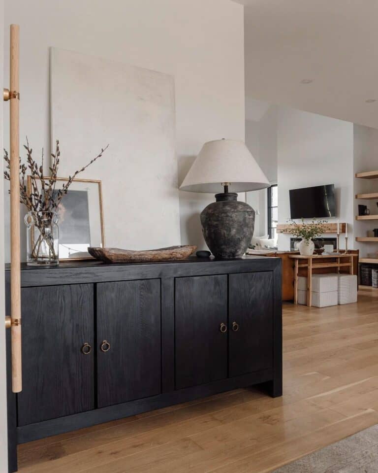 Large Grey Lamp on a Black Sideboard