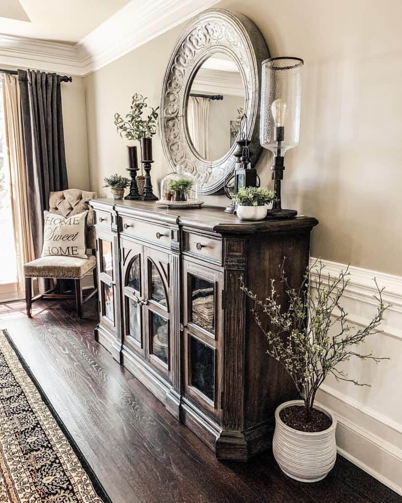 Large Mirror Over Dark Wood Sideboard