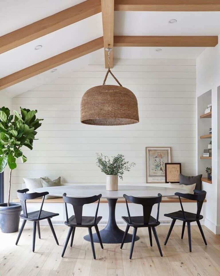Large Rattan Hanging Light Fixture and a White Shiplap Wall