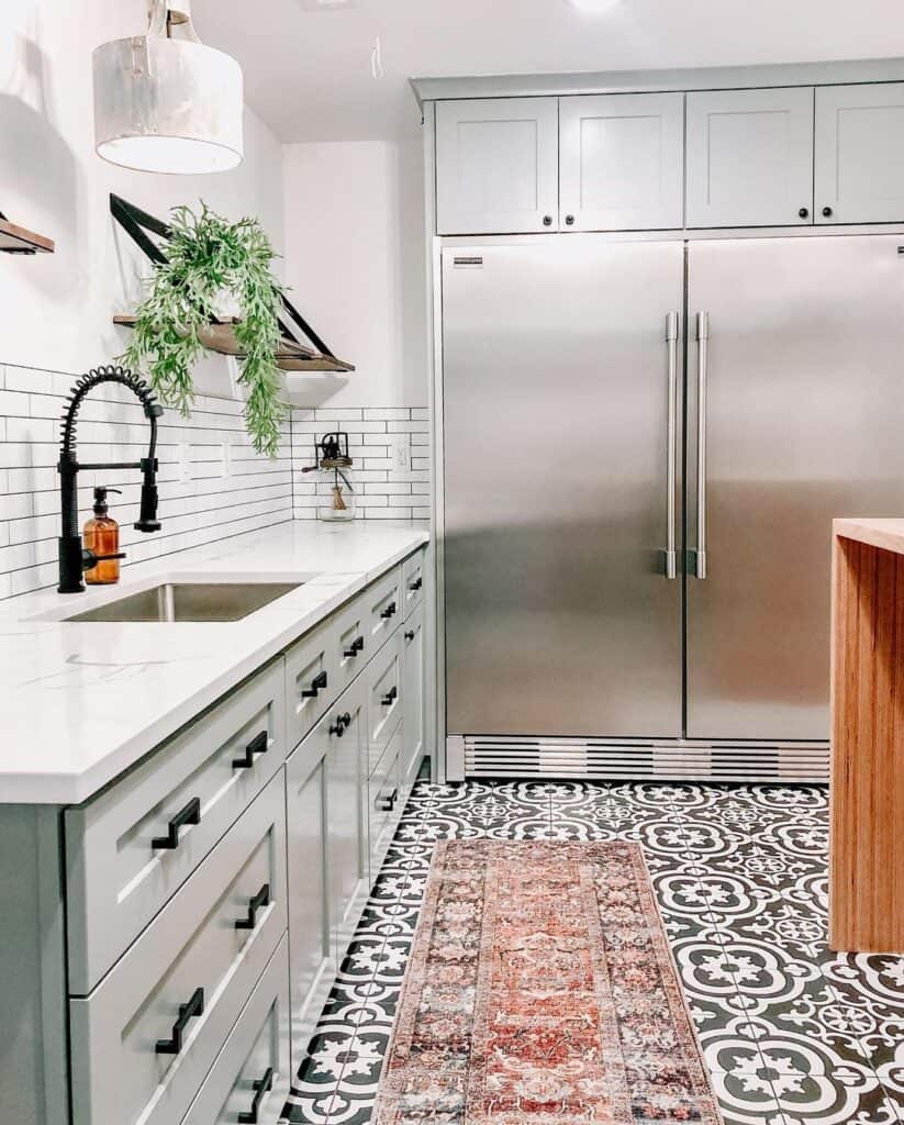 Large Stainless Refrigerator with Gray Cabinets