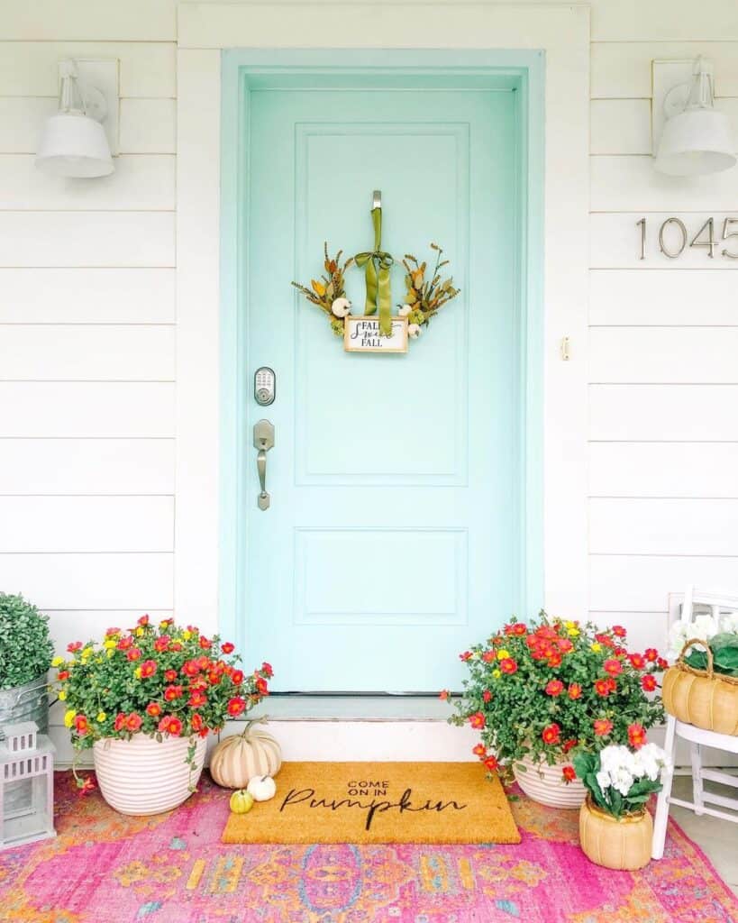 Flower Filled Porch with Light Blue Door