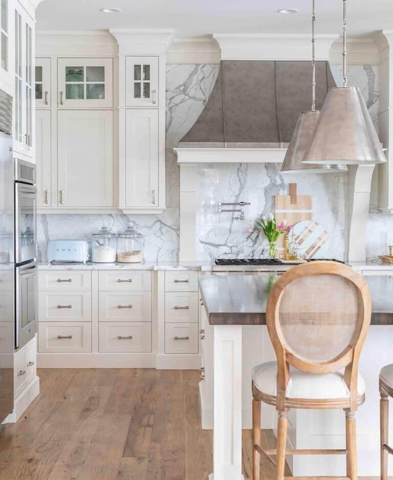 Light Grey Marble Backsplash With White Kitchen Cabinets