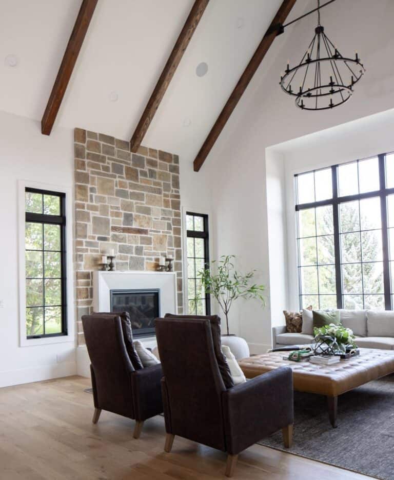 Living Room With Stone Fireplace and Vaulted Ceiling