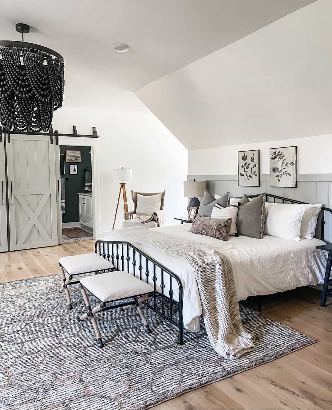 Low Sloped Ceiling Bedroom with Black Chandelier Soul & Lane