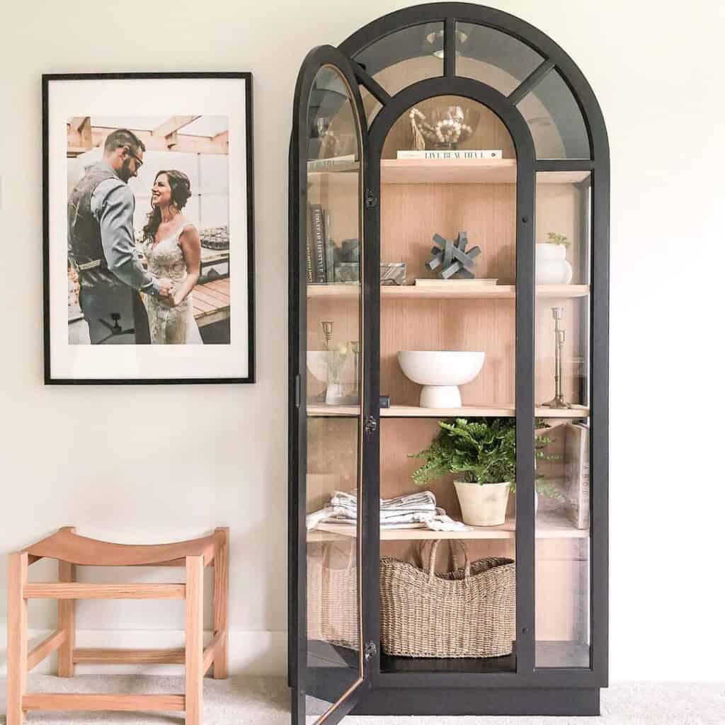 Modern Black China Cabinet Against Taupe Wall