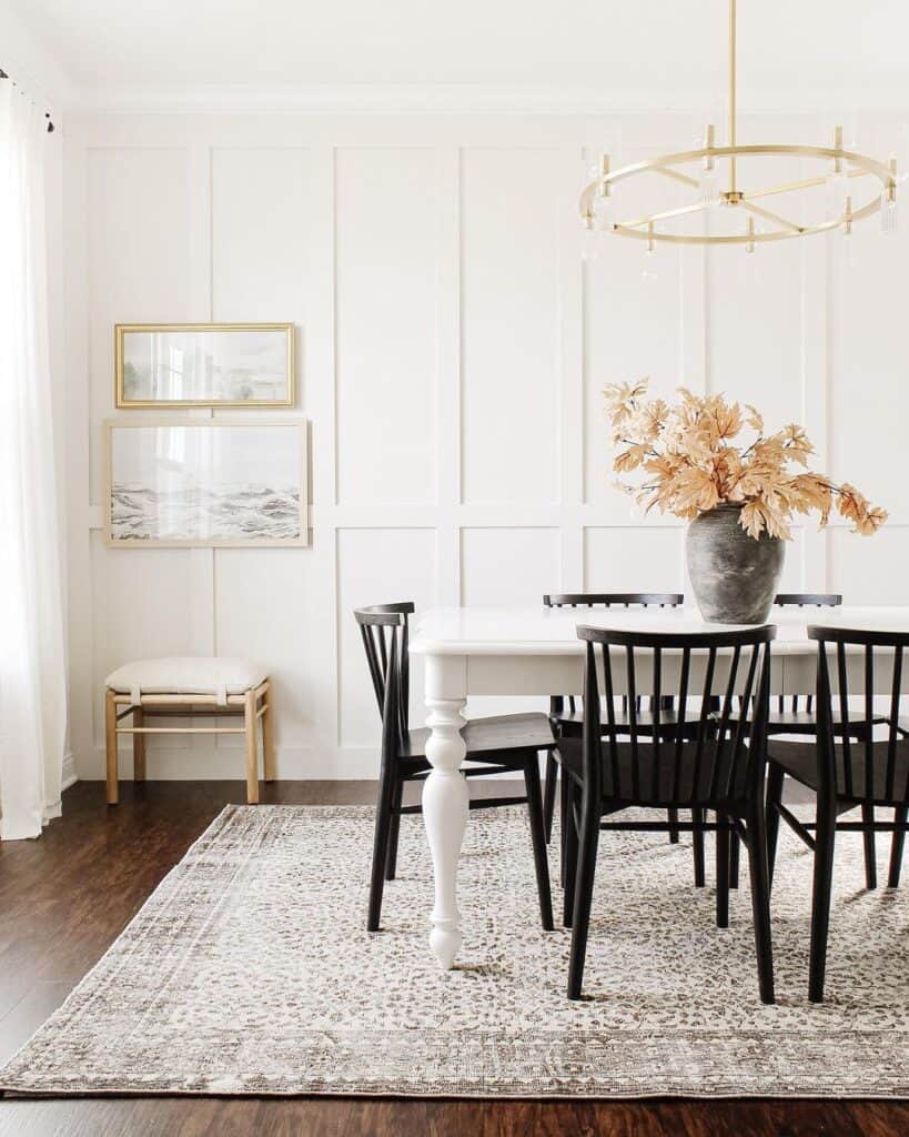 Modern Black Wood Dining Chairs in White Paneled Dining Room