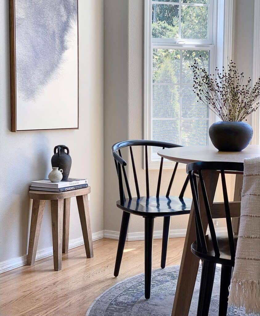 Modern Black Wood Dining Chairs on a Round Beige Rug