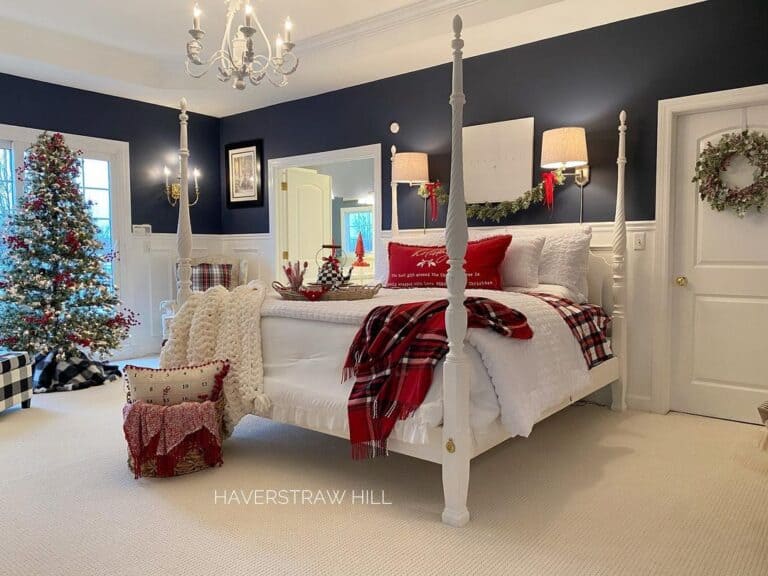 Navy and White Primary Bedroom With a Four Poster Bed