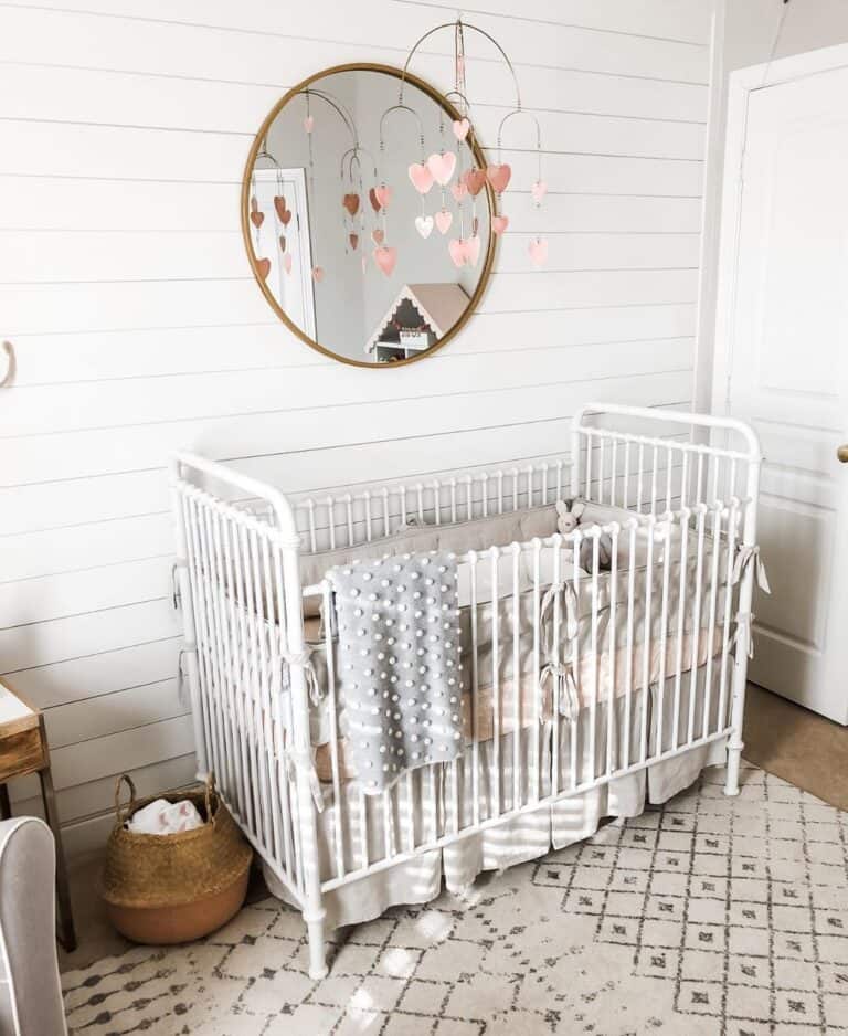 Neutral Pink Nursery with White Spindle Crib