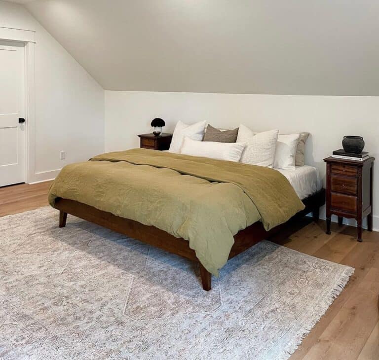 Off-White Area Rug in Bedroom With Gabled Walls