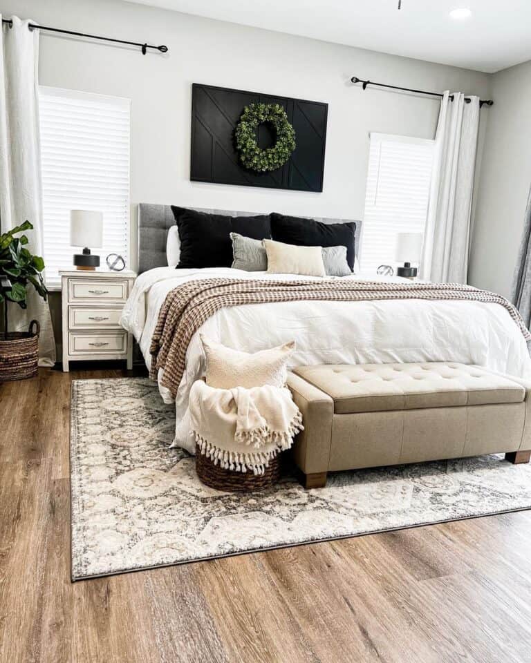 Off-White Rug Under a Bed With White Comforter