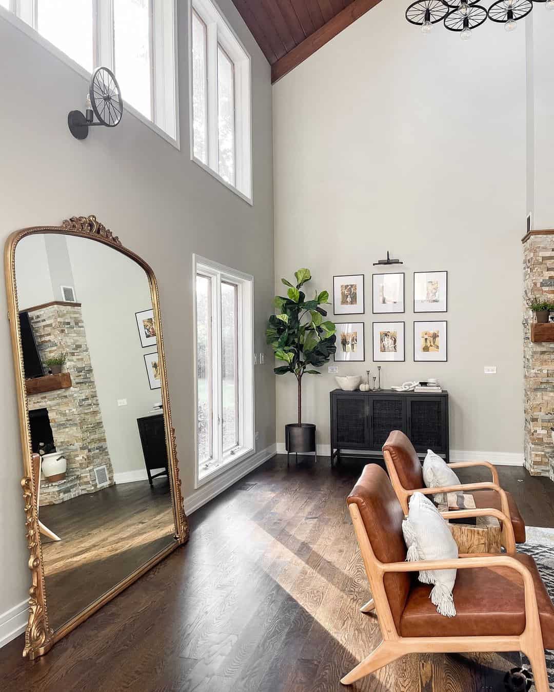 Ornate Gold Filigree Floor Mirror Against a Light Grey Wall Soul & Lane