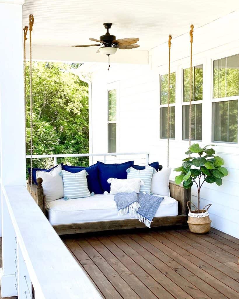 Outdoor Daybed with Blue Accent Pillows