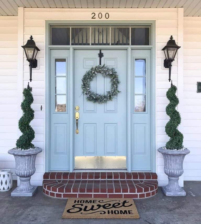 Pale Blue Entryway with Brick Steps
