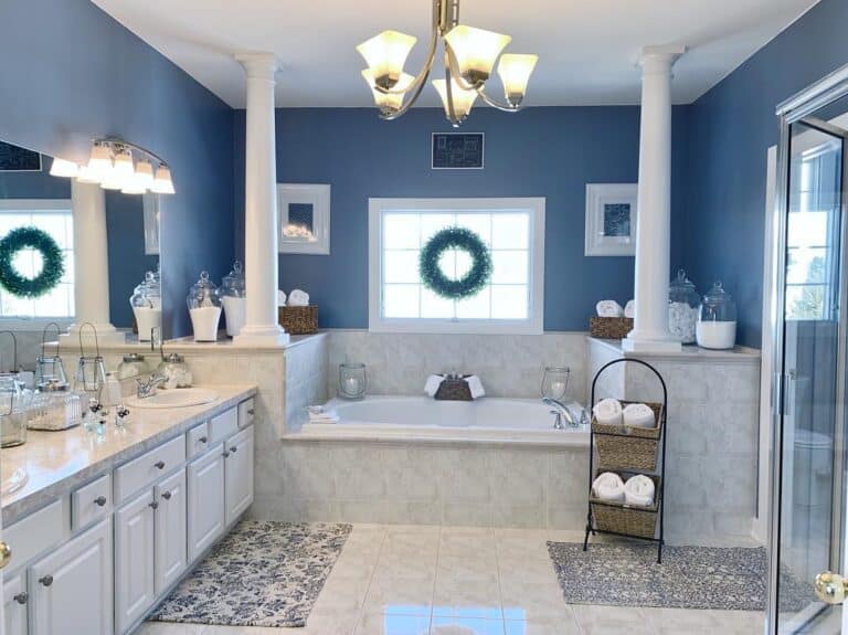 Pale Blue Walls Around Pillared Bathtub