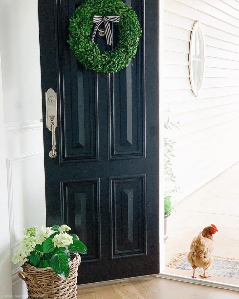 Paneled Black Front Door with Green Wreath
