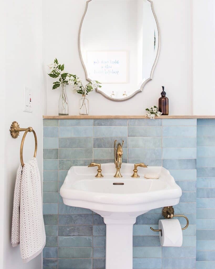 Pedestal Sink Against Blue Tile Wall