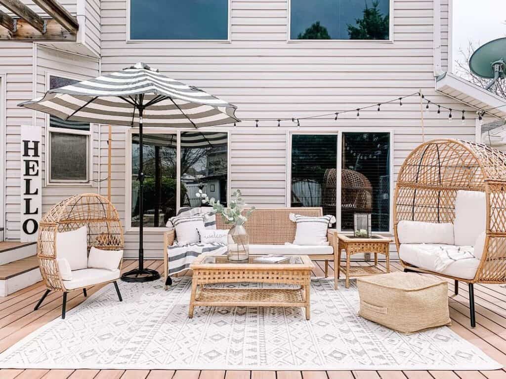 Porch Featuring Wicker Chairs and End Table Decor