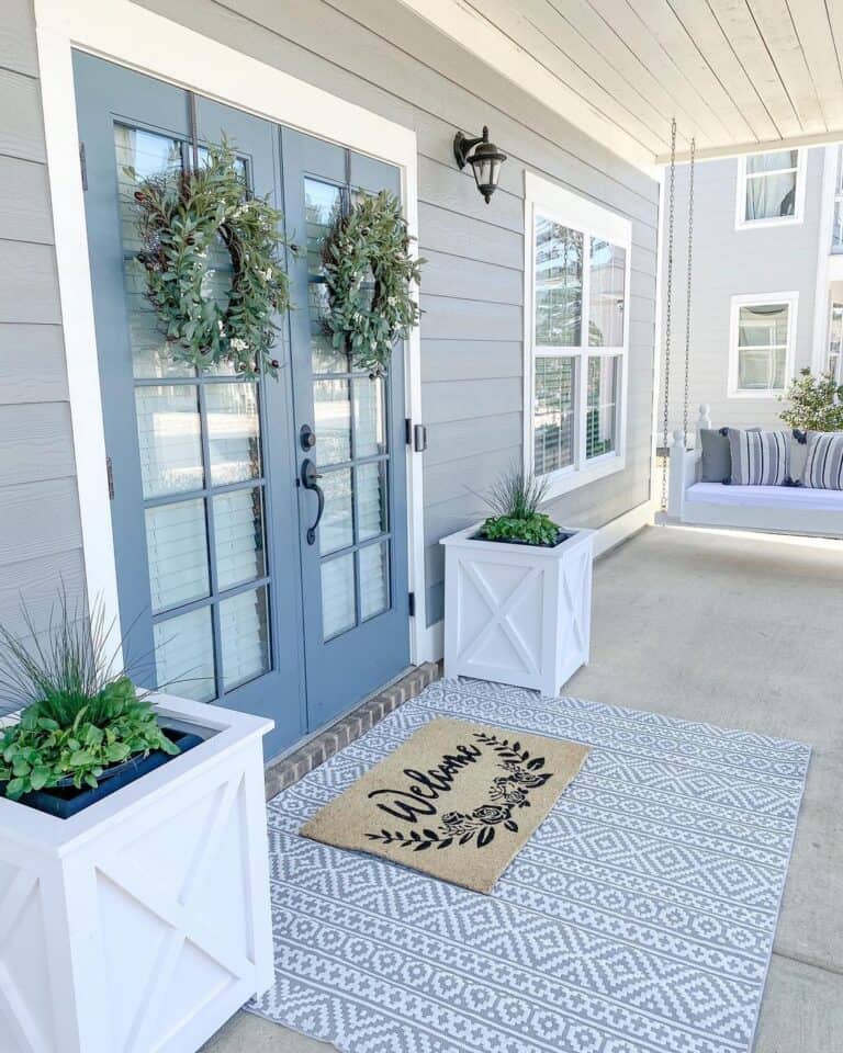 Porch Swing with Blue and White Décor