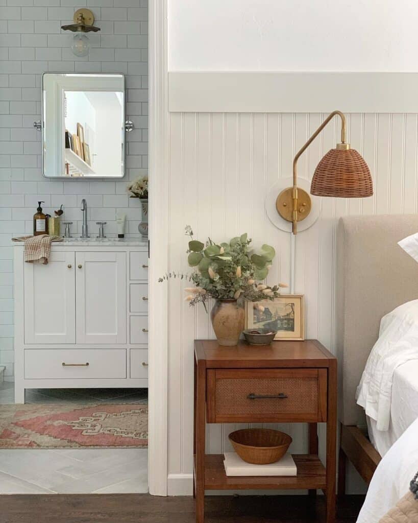 Rattan Light Fixture Illuminating a Small Bedside Stand