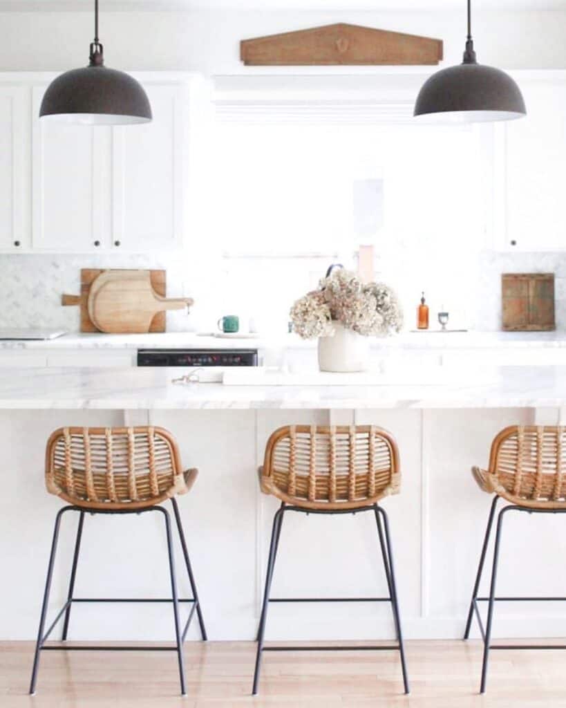 Rattan Stools Under Black Pendant Lighting