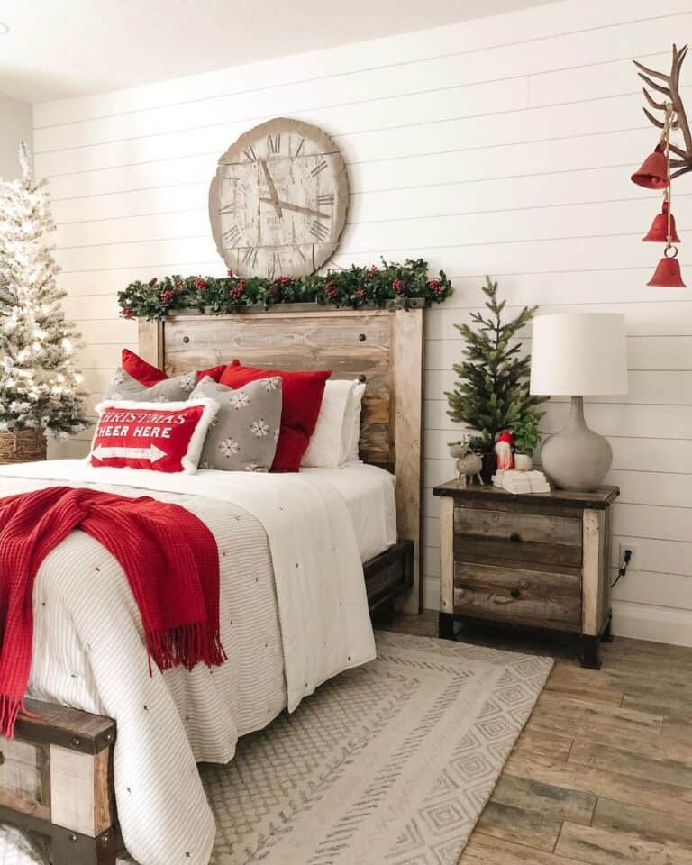 Red Accents in a Bedroom with White Shiplap Walls