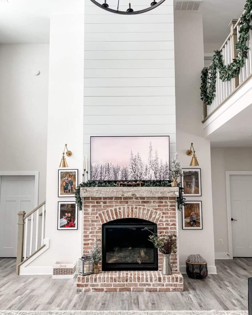 Red Brick Fireplace Between Gold Sconces