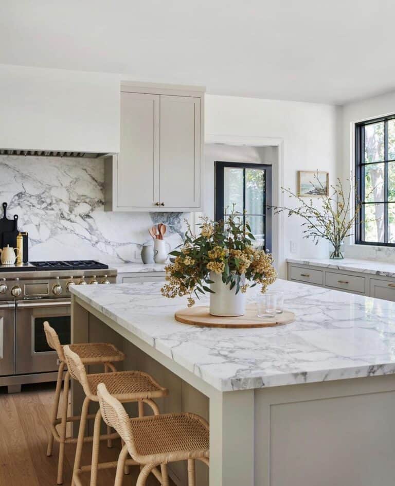 Stone Backsplash With a Light Grey Cabinet