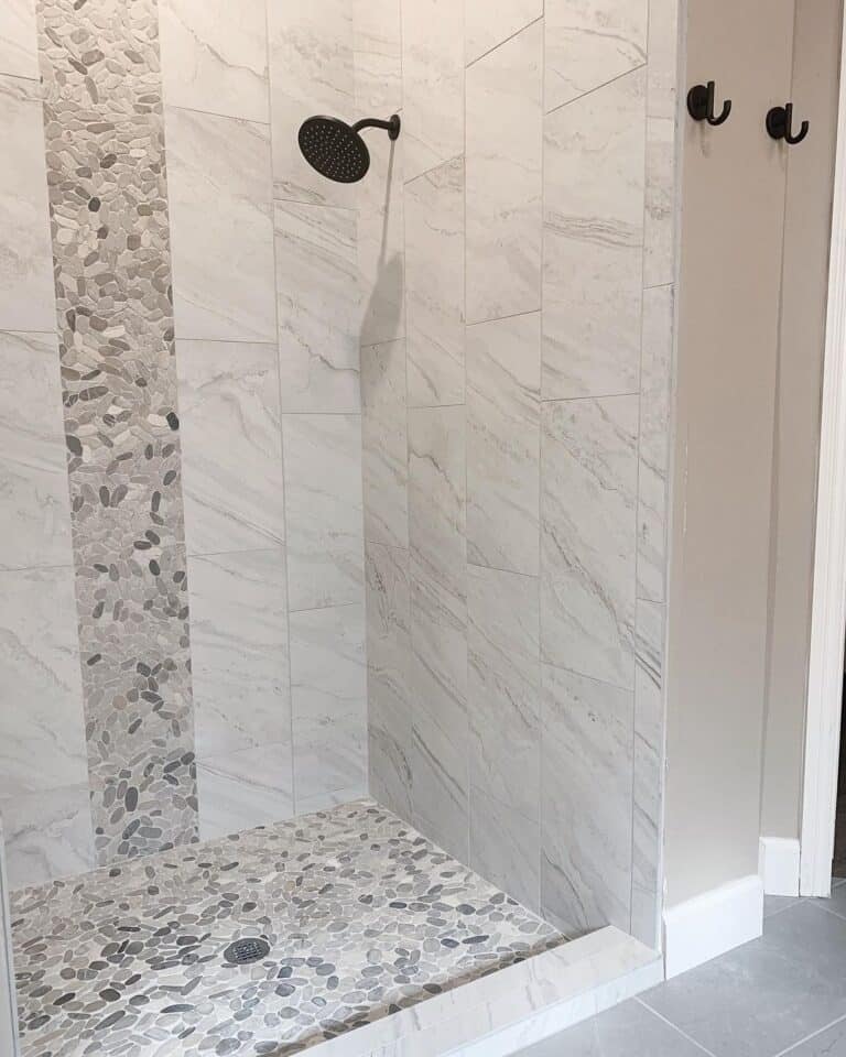 Stone Shower Floor and Large Light Grey Tile Walls