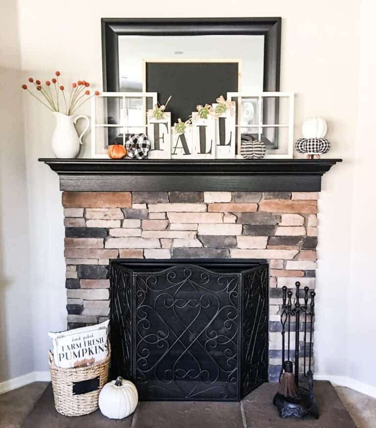 Stone and Black Fireplace Mantel with Fall Décor