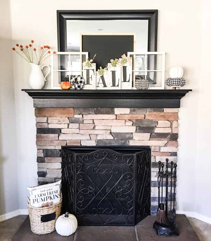 Stone and Black Fireplace Mantel with Fall Décor