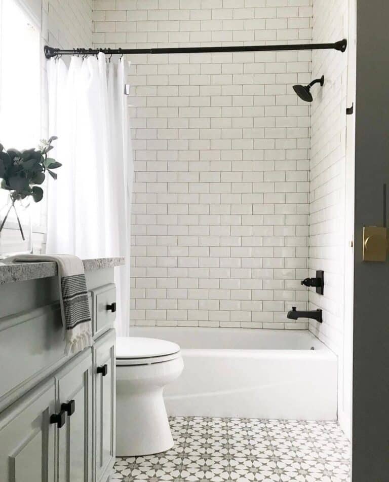 Subway Tile Tub Surround and Black Fixtures
