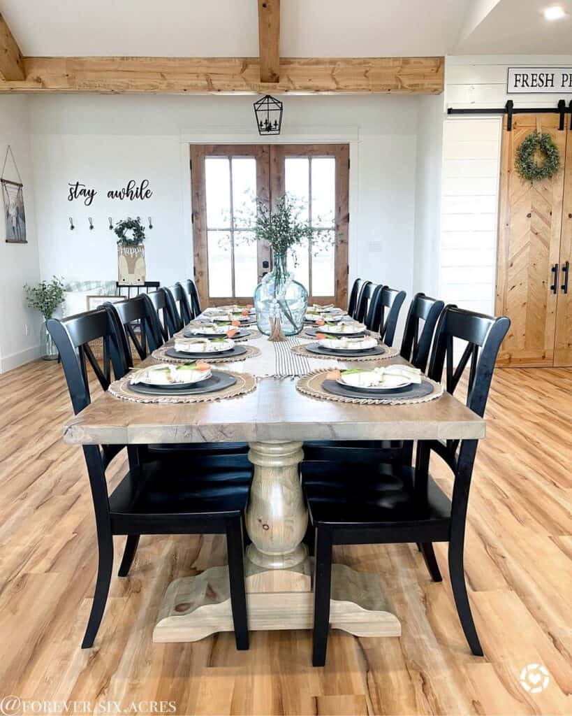 Ten Black Wood Dining Chairs and a Long Wood Table