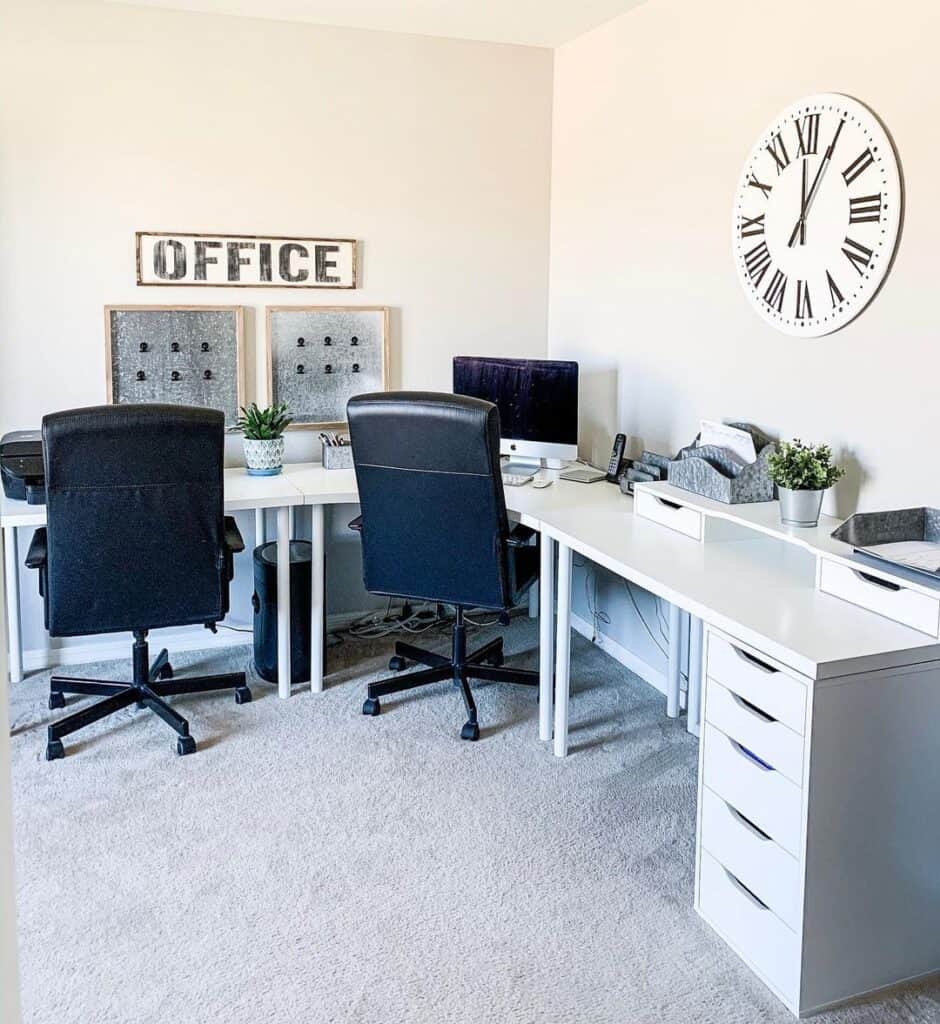 Two Chairs Under a Large Modern White Desk with Drawers