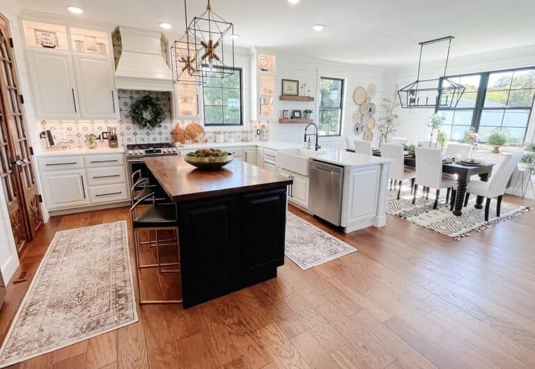 Two Off-White Kitchen Runner Rugs and a Black Kitchen Island