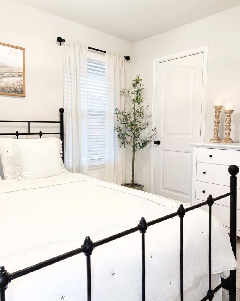 White Bedroom with Contrasting Black Bedframe