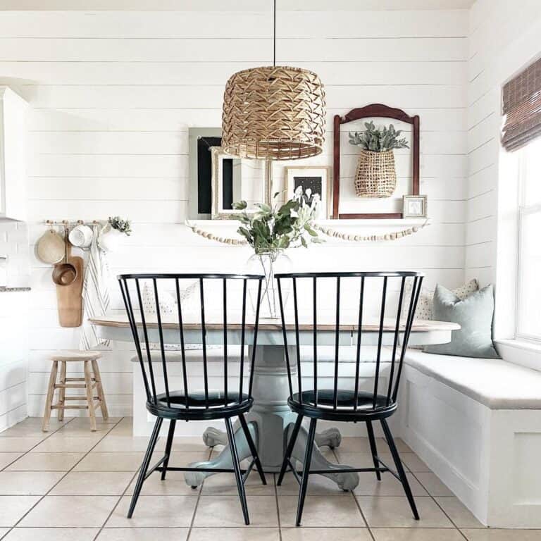 White Breakfast Nook with Black Chairs