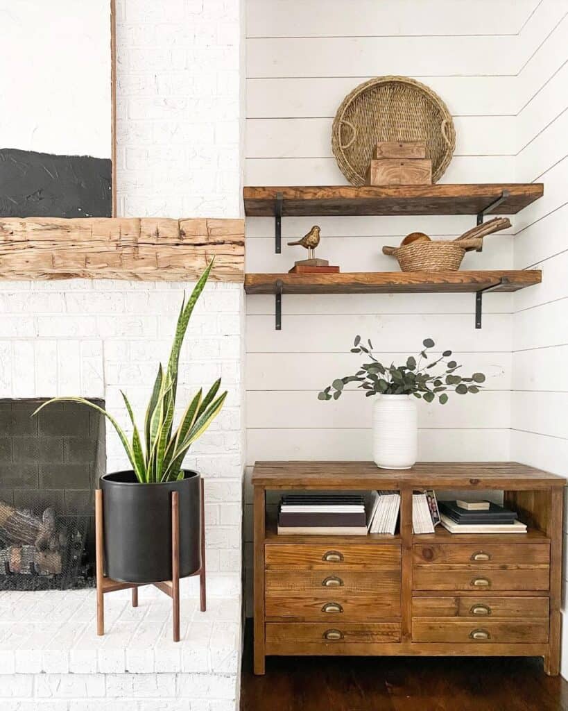 White Brick Fireplace Nook with Floating Shelves