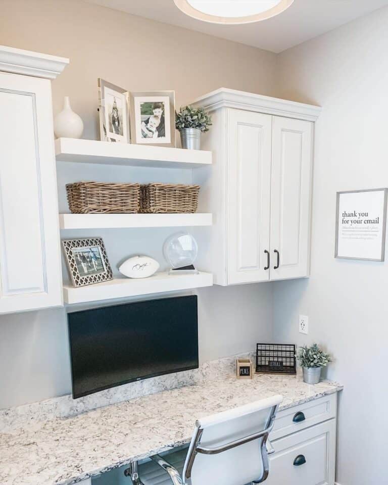 White Cabinets Over a White Desk with Drawers
