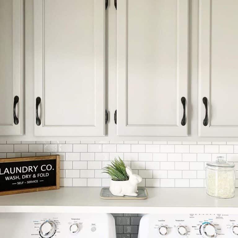 White Ceramic Rabbit With White Subway Tile Backsplash