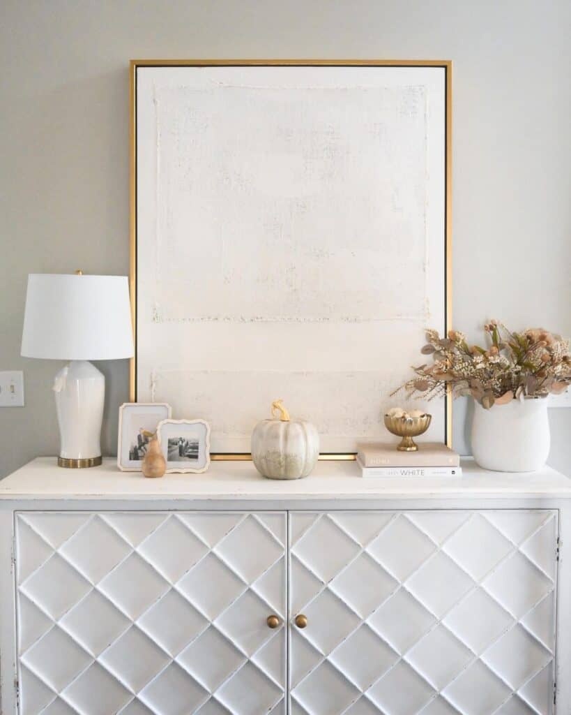 White Console Table with Gold Frame Artwork