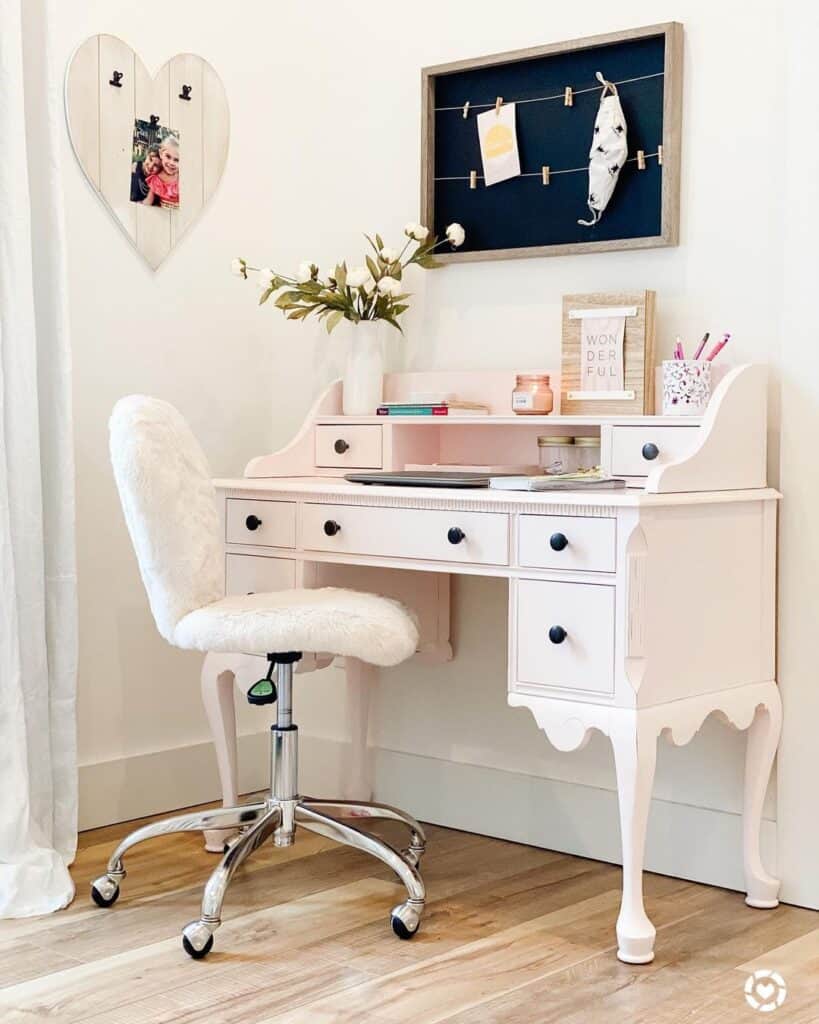 White Flowers on a White Desk with Black Knobs