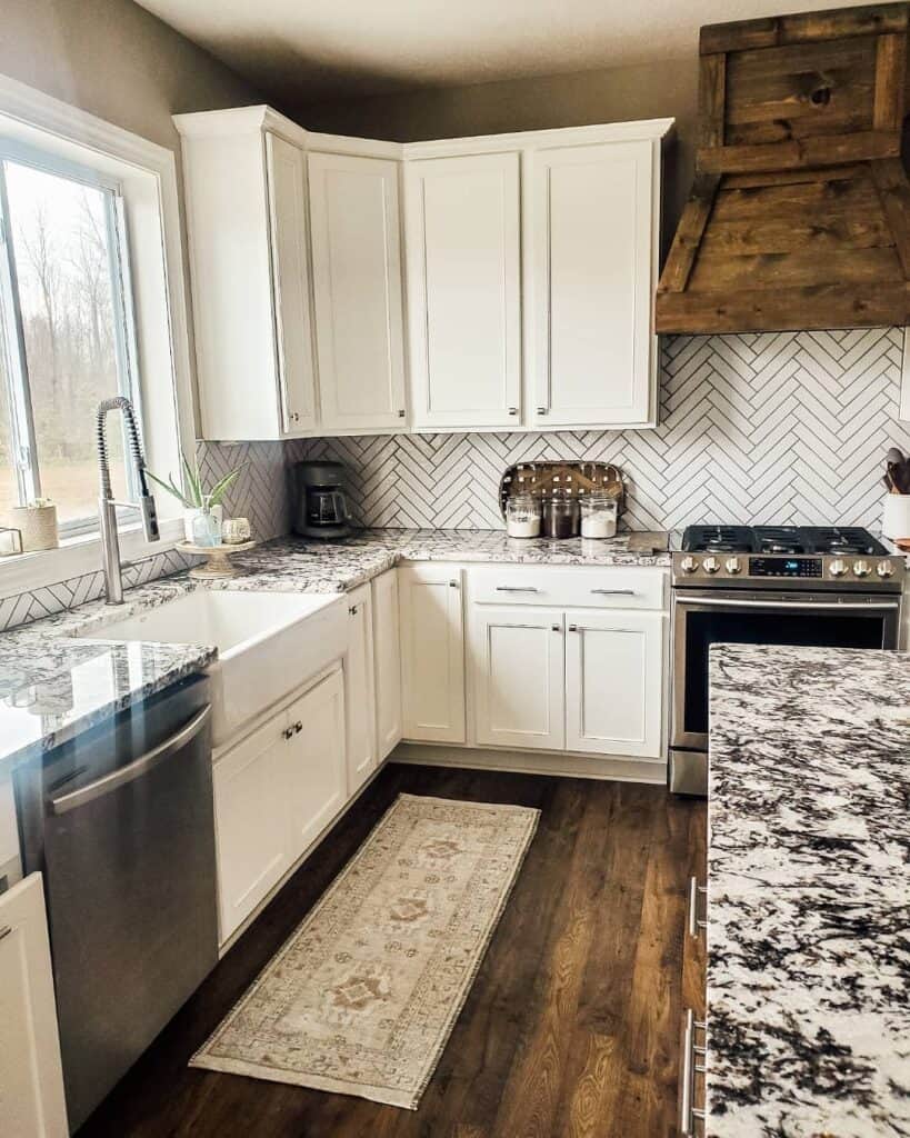 White Herringbone Backsplash for Busy Granite Countertops