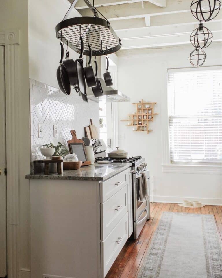 White Herringbone Tile Backsplash with White Tile Trim
